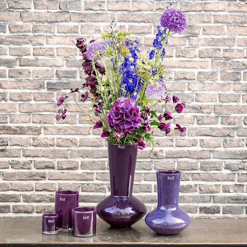 Lowlands Design plum glass vase collection with tall floral centrepiece and matching small vases and tealight holders