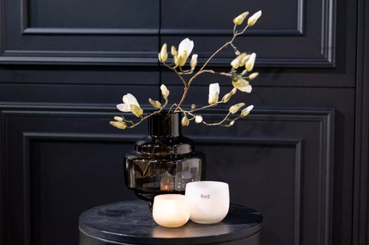 Lowlands Design premium handblown vase UK smoky glass design with magnolia stems on round table