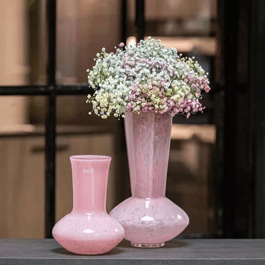 Lowlands Design rose pink glass vase pair featuring tall marbled vase with pastel gypsophila and smaller bulbous vase