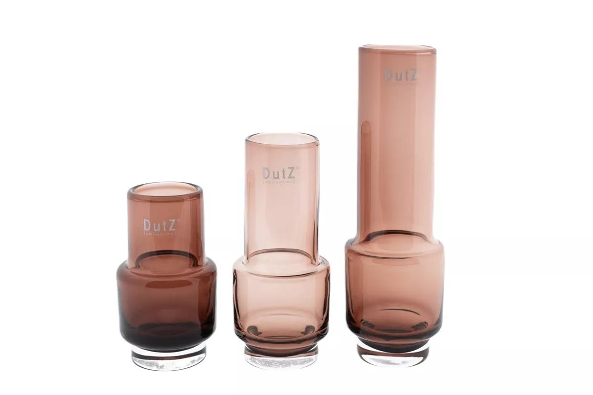 Set of three Lowlands Design modern brown glass vases with varying heights and cylindrical shapes