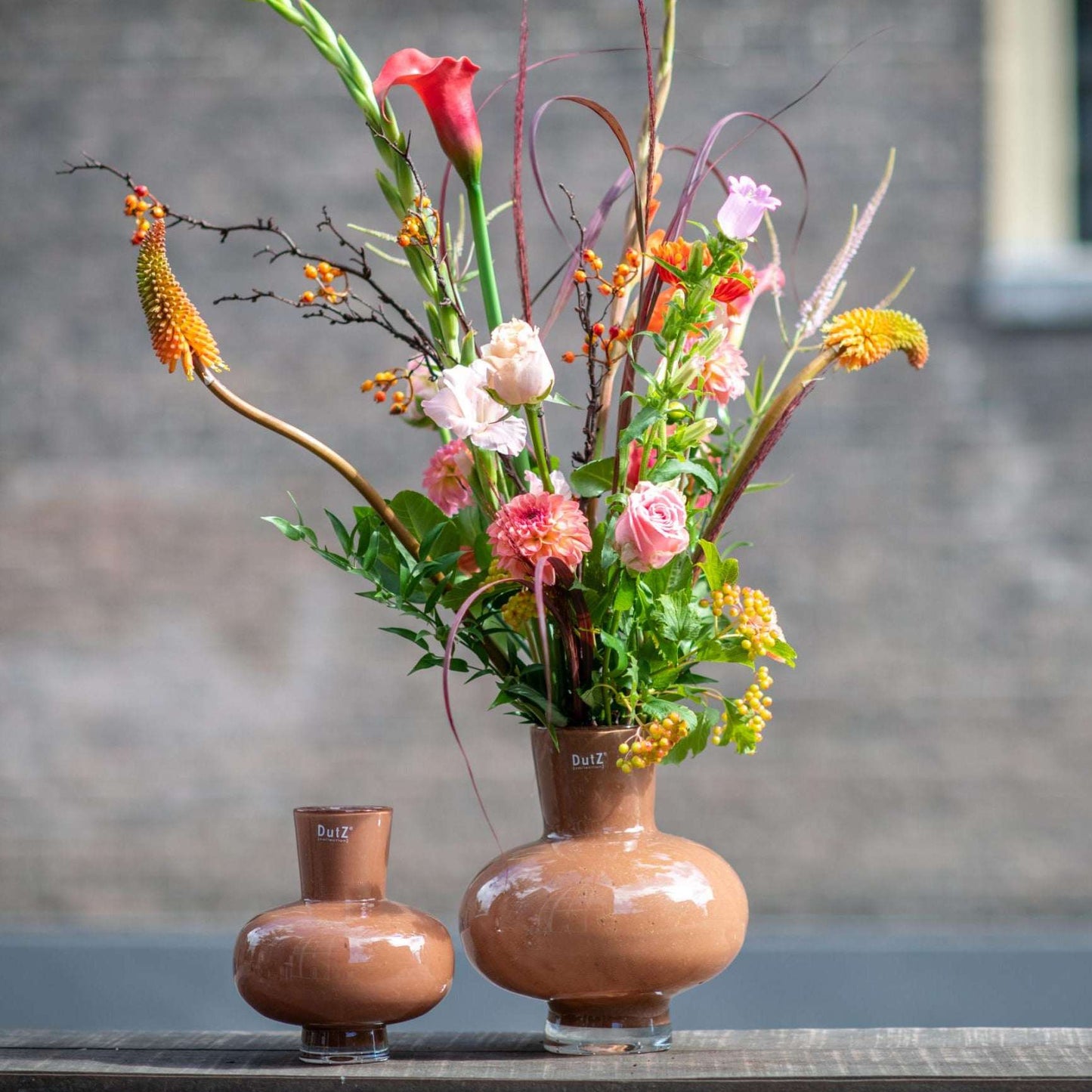 Lowlands Design glass vase flower bouquet displaying colourful flowers and natural greenery