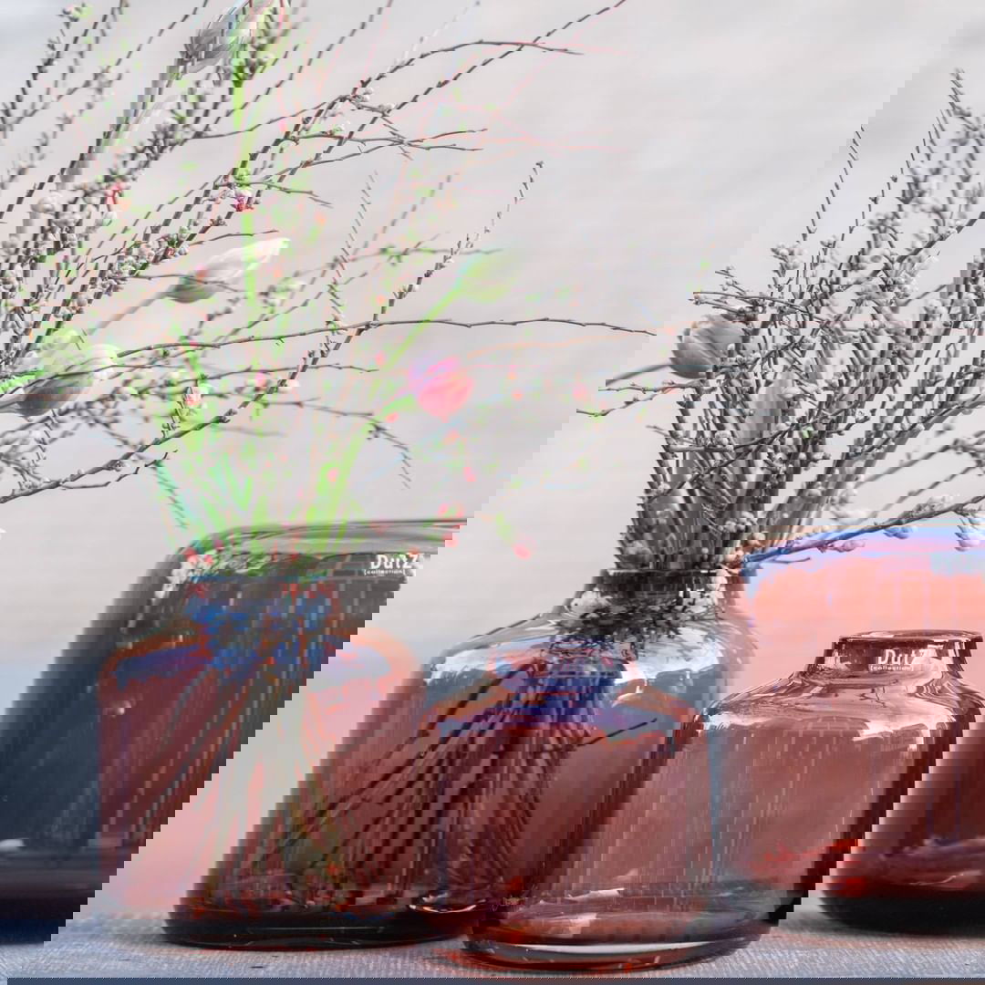 Lowlands Design set of three amber glass vases with delicate flower and branch arrangements