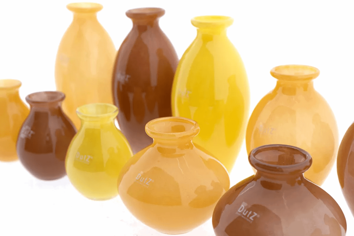 Lowlands Design vase set with glossy ceramic vases in yellow, brown, and orange shades