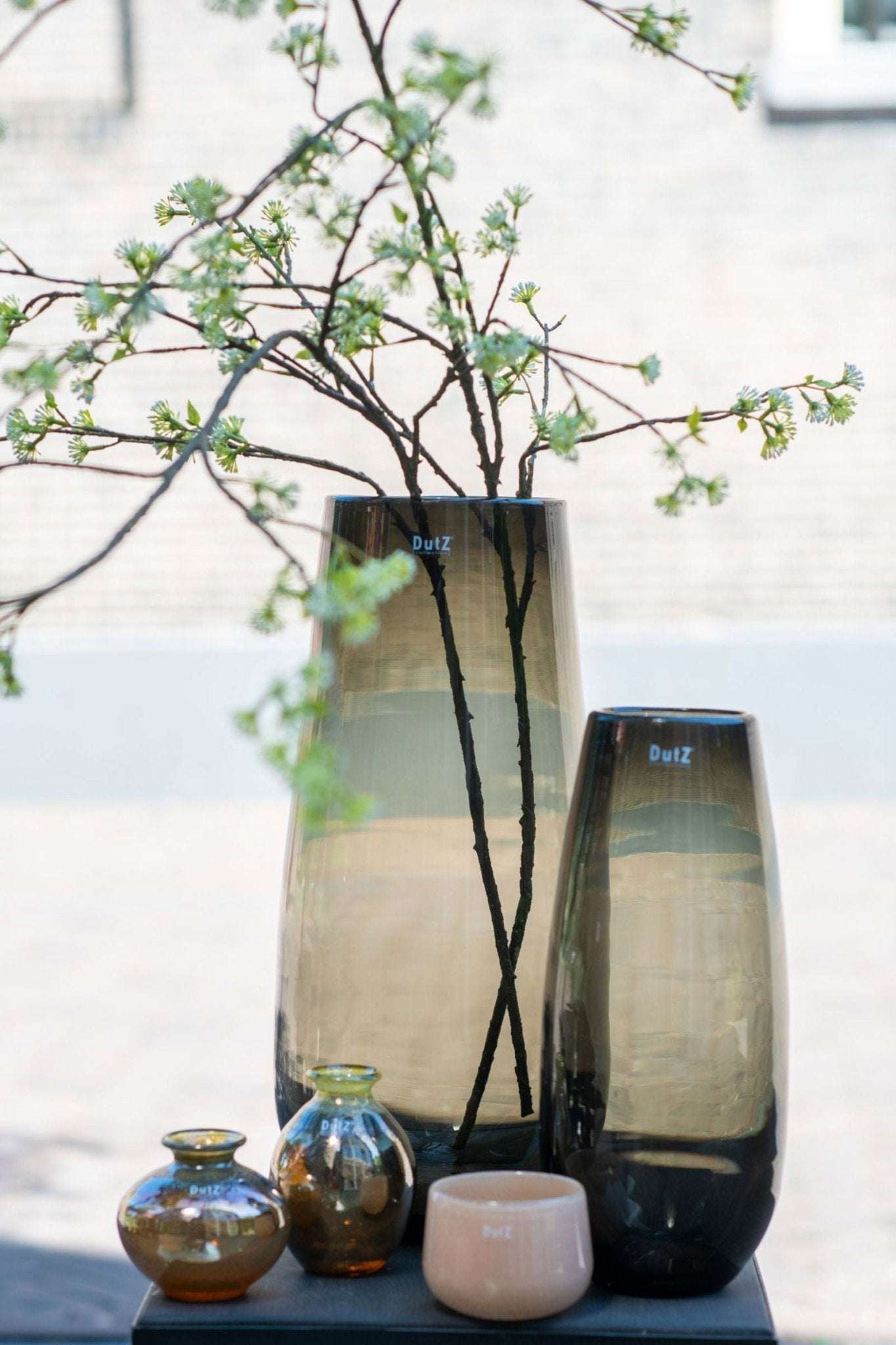 Set of Lowlands Design glass vases in varying sizes with a minimalist style and muted colours
