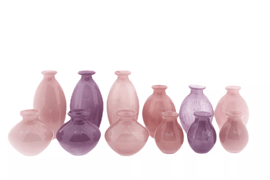 Lowlands Design vase set featuring pink and purple decorative ceramic vases in various sizes and shapes