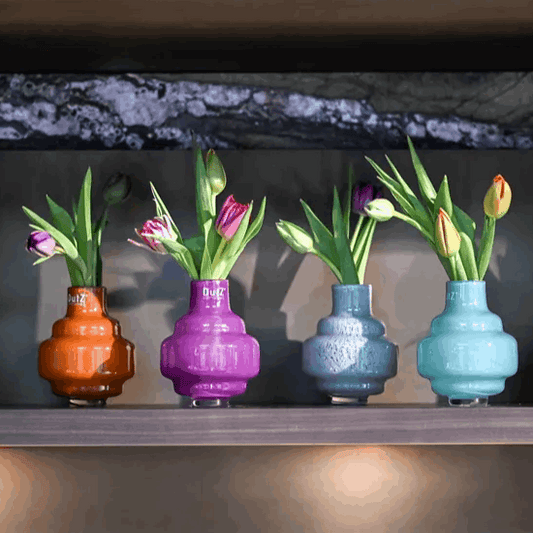 Lowlands Design colorful small vases small with tulips in orange purple blue and teal colors