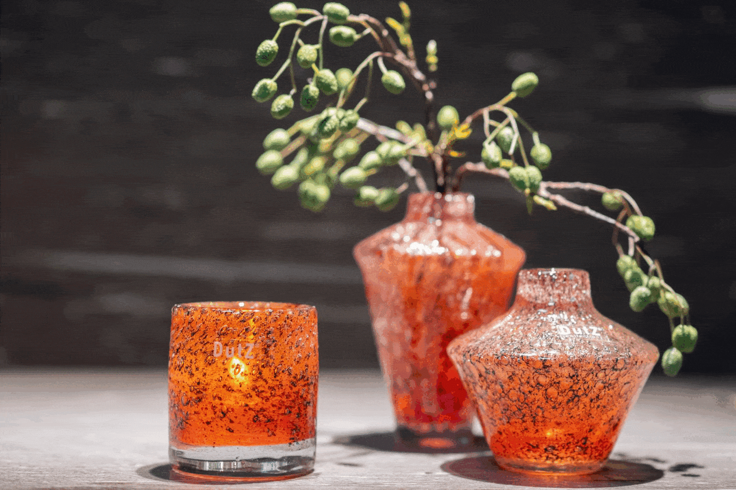 Lowlands Design glass diffuser vase in orange with decorative twigs for stylish floral arrangements