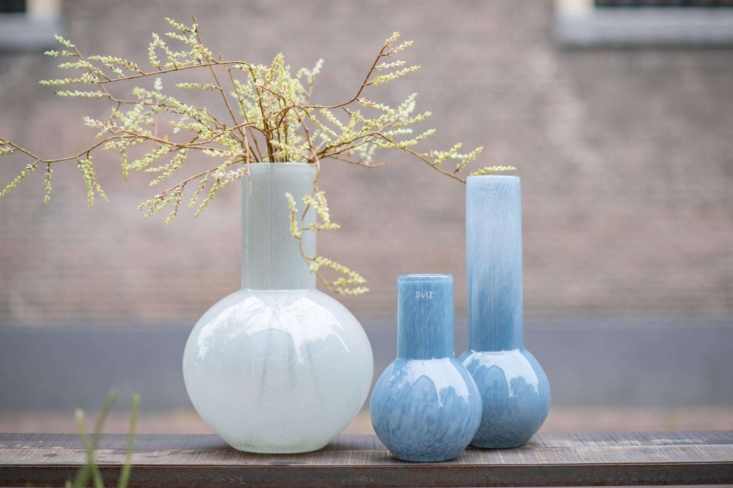 Lowlands Design flowervase glass grey with beautiful floral arrangement in three unique shapes