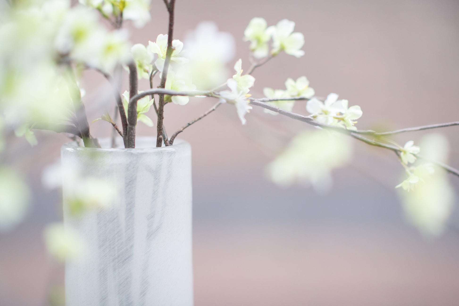 Lowlands Design flowervase glass grey showcasing delicate branches and blossoms in a stylish arrangement