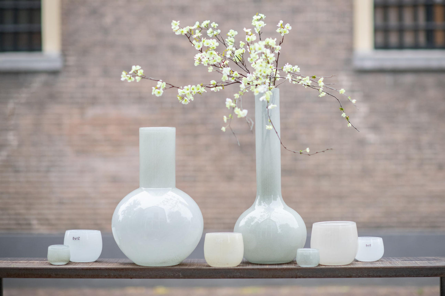 Flowervase glass grey collection by Lowlands Design with delicate branches in stunning vases