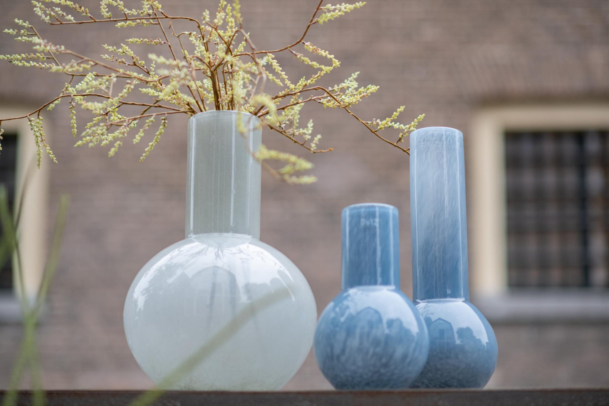Lowlands Design flowervase glass grey with elegant design, showcasing decorative stems