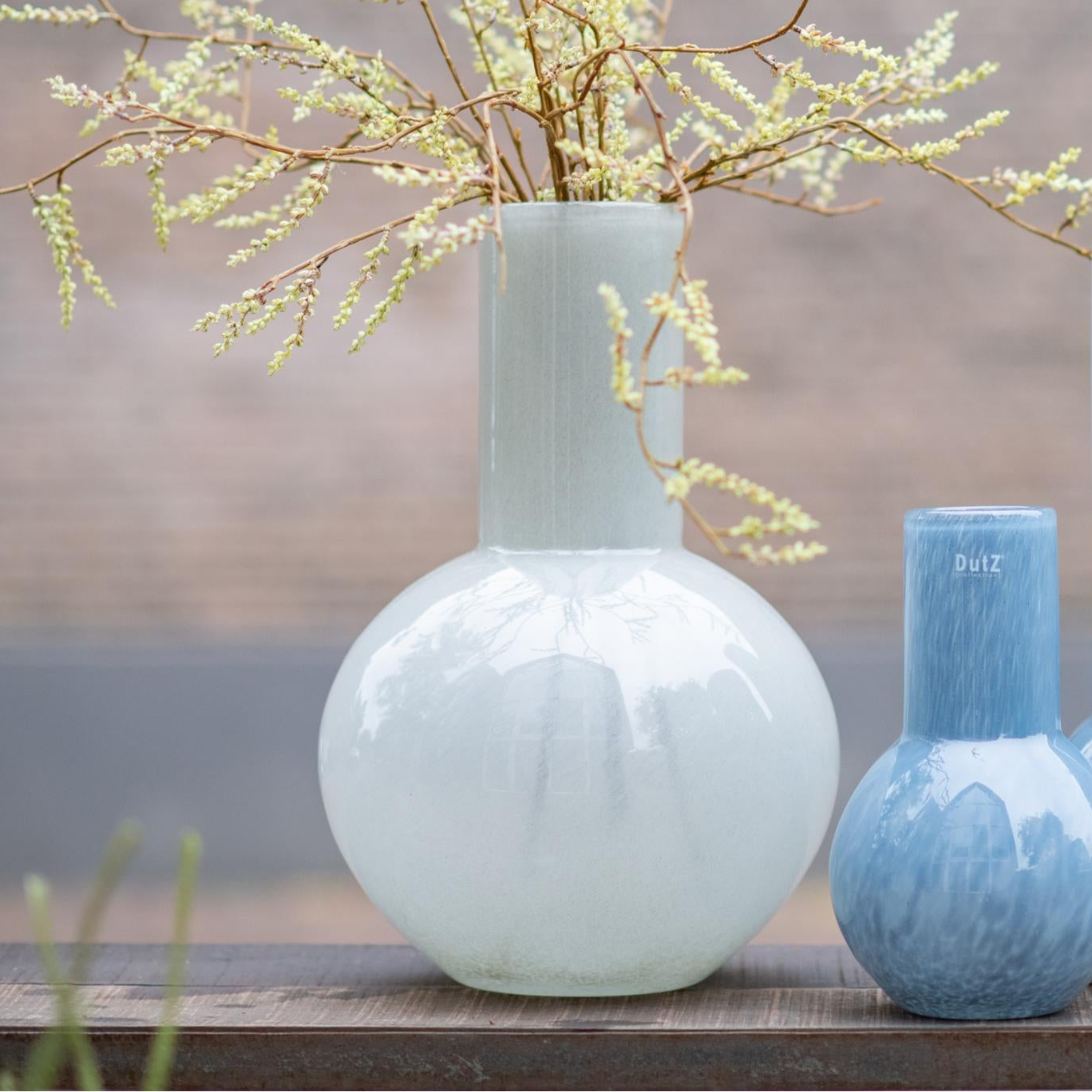 Lowlands Design flowervase glass grey with a modern round shape, ideal for stylish home decor