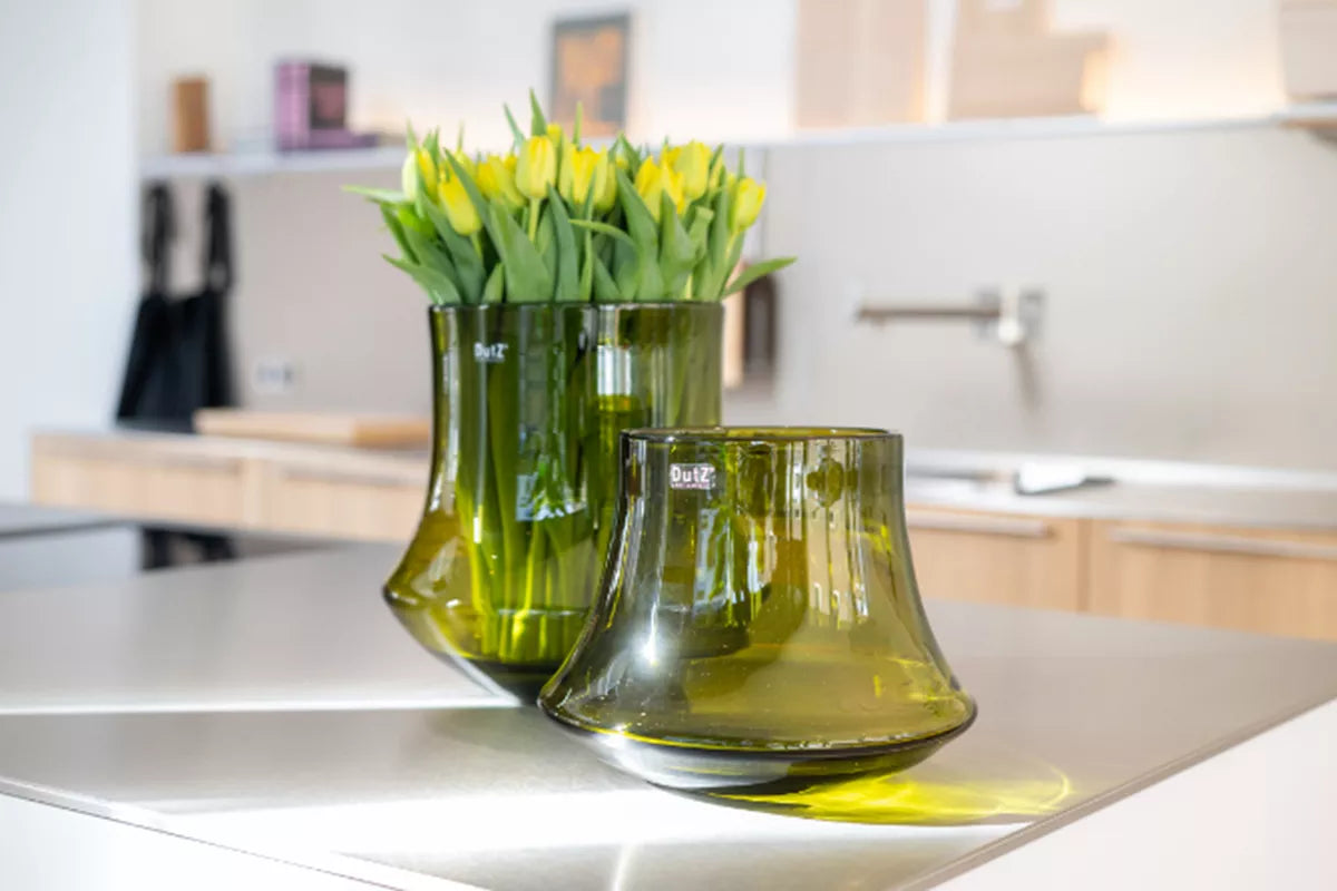 Lowlands Design flowervase glass mouthblown in green with fresh yellow tulips for stylish decor