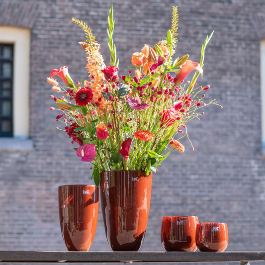 Elegant Lowlands Design flowervase glass in amber with vibrant floral arrangement for home decor