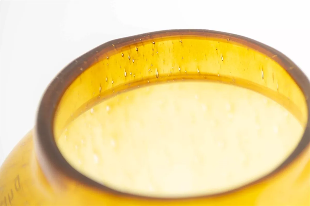 Close-up of Lowlands Design Glass Flowervase BARREL featuring a unique amber tint and textured surface