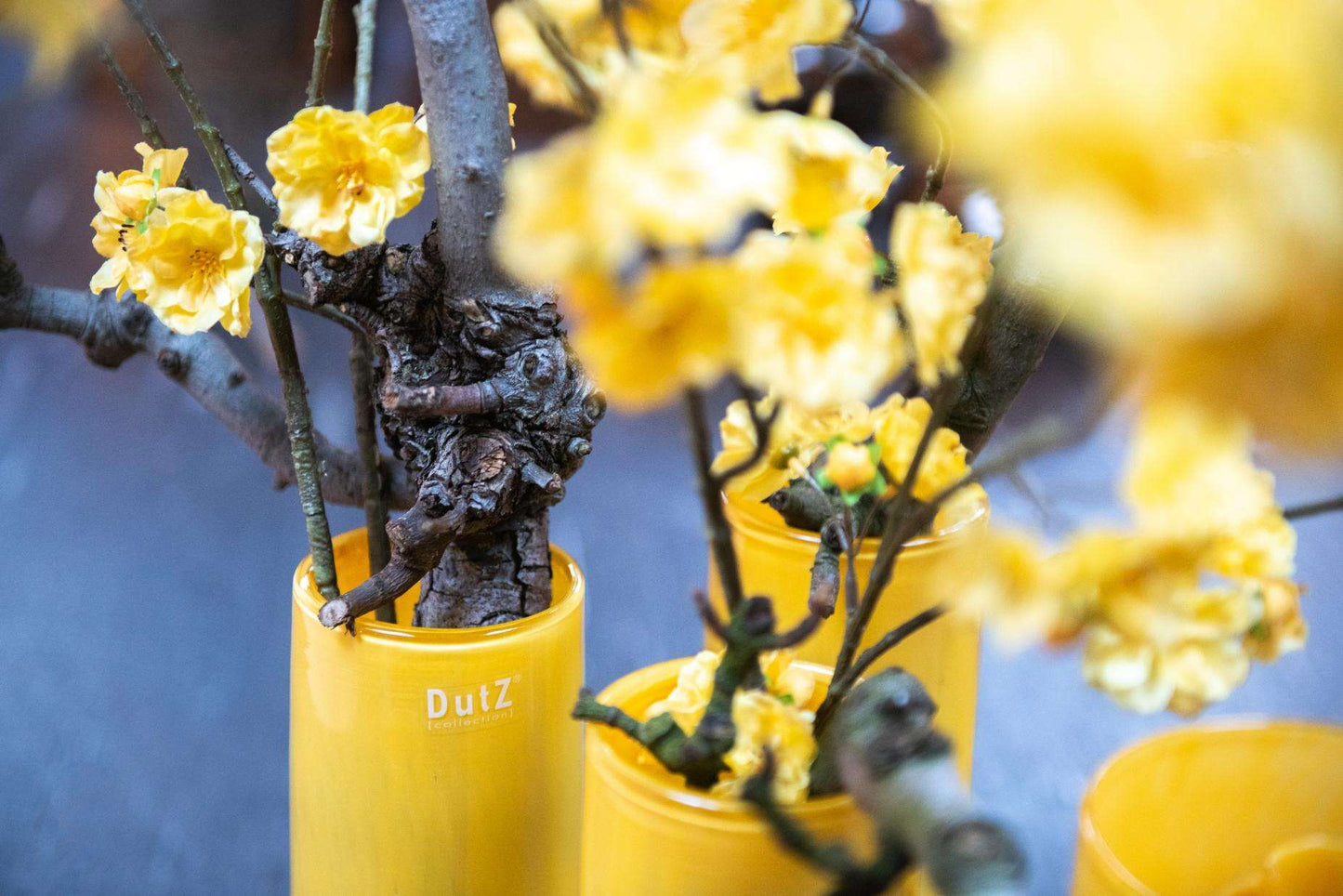 Lowlands Design Glass Flowervase - Stylish Centrepiece featuring vibrant yellow flowers and natural branches