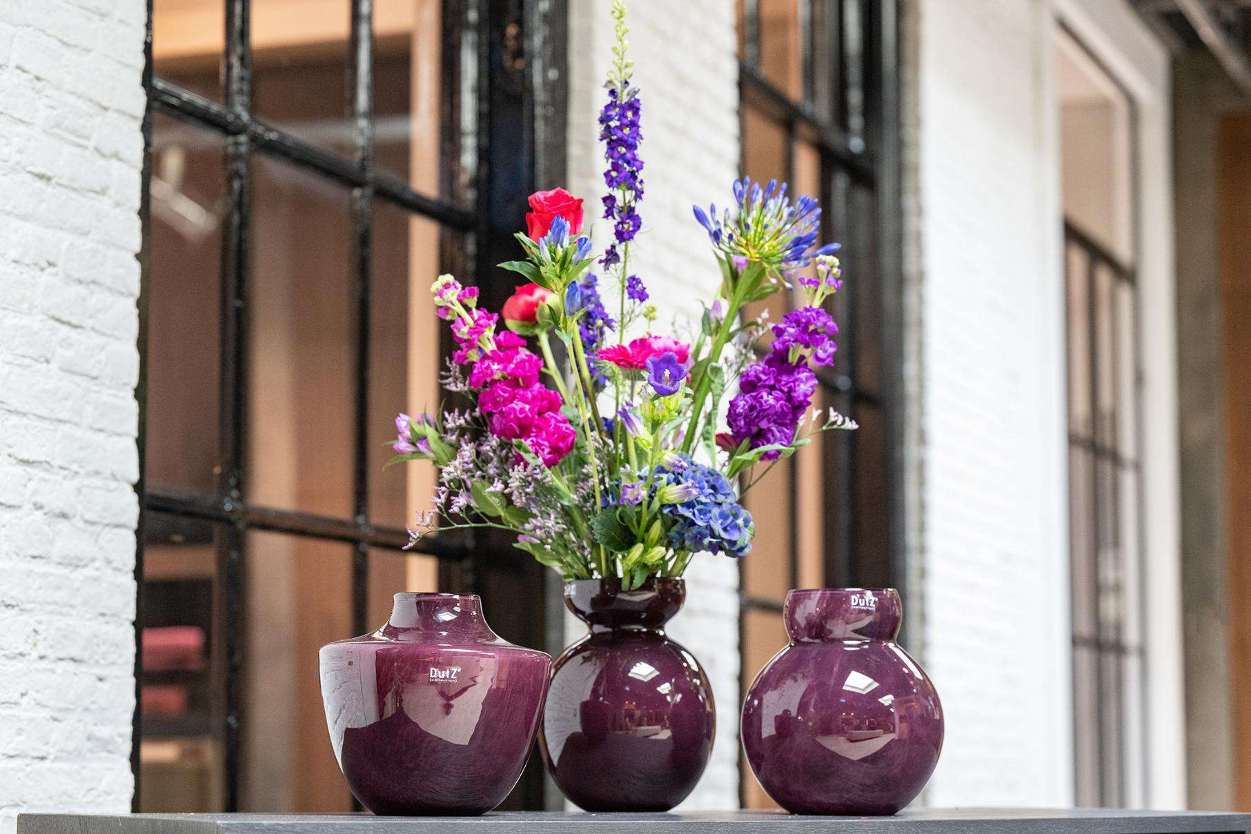 Collection of Lowlands Design glass posy vase plum with vibrant flowers in three stylish shapes