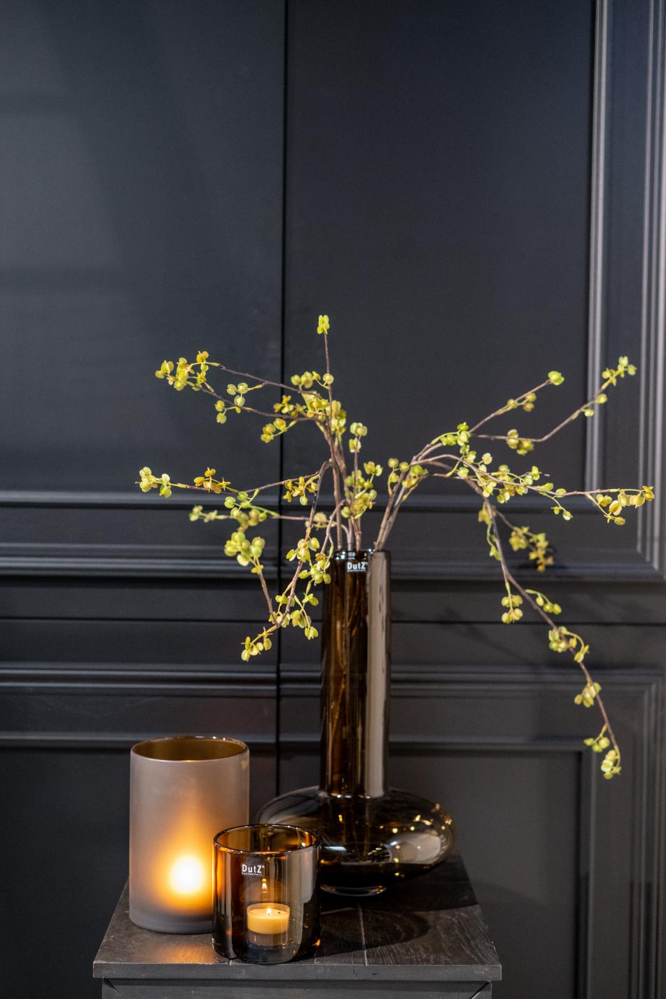 Elegant Lowlands Design mouthblown glass vase with decorative branches and subtle candlelight