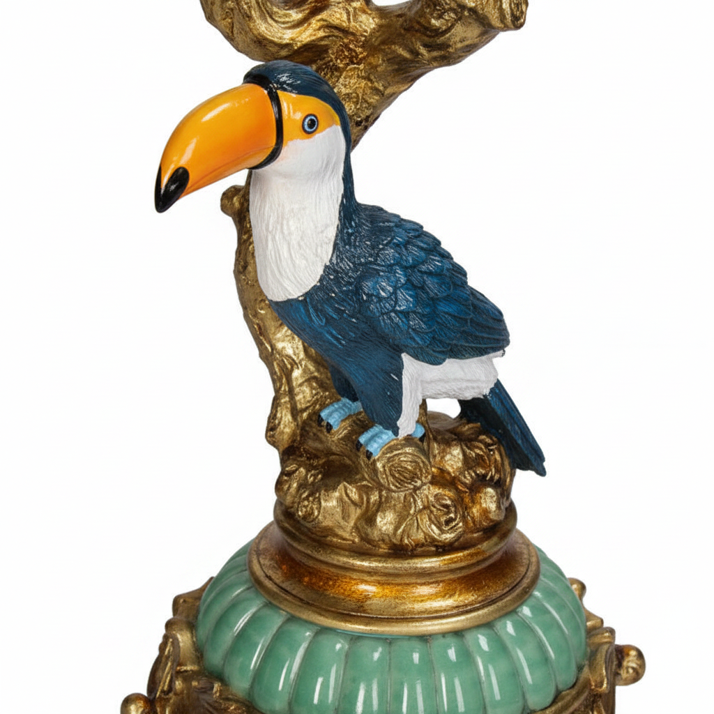 Lowlands Design vintage bird candelabra in gold and blue featuring a toucan perched on an ornate base